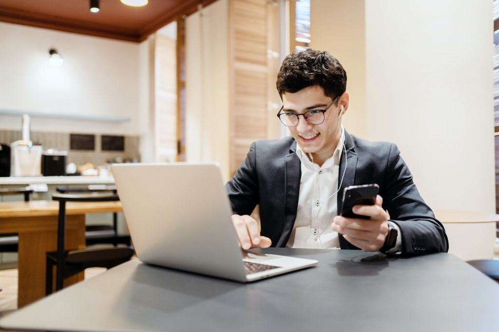 A male businessman is a manager working with a laptop in an office coworking. The lawyer draws